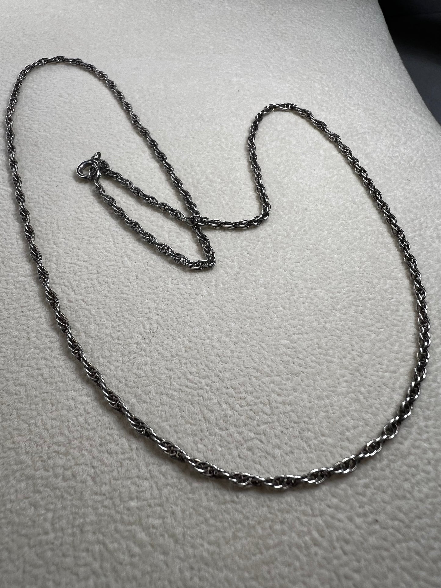 This vintage classic sterling silver 18" rope chain offers a subtle touch of timeless style. Its delicate design works beautifully on its own or as a perfect complement to one of our pendants.