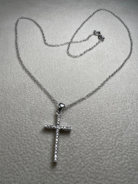 This sterling silver cross pendant necklace from V3 Jewelers features a single center diamond, combining classic design with subtle sparkle. This is a meaningful accessory that adds a graceful touch to any outfit while symbolizing faith and style.