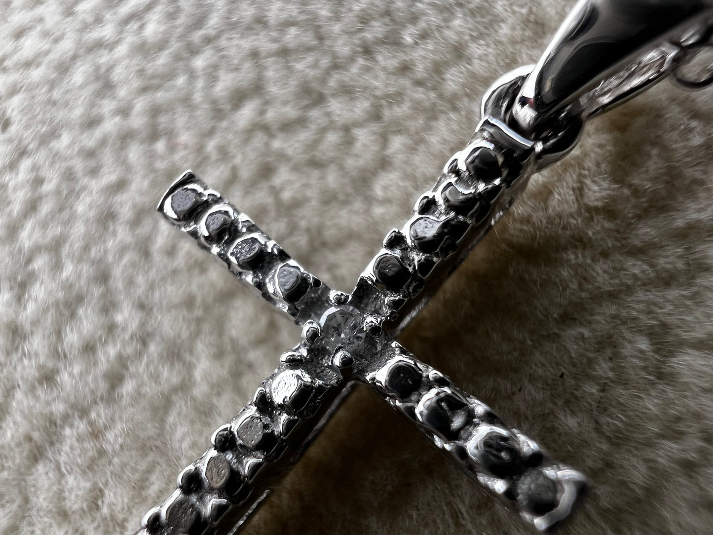This sterling silver cross pendant necklace from V3 Jewelers features a single center diamond, combining classic design with subtle sparkle. This is a meaningful accessory that adds a graceful touch to any outfit while symbolizing faith and style.
