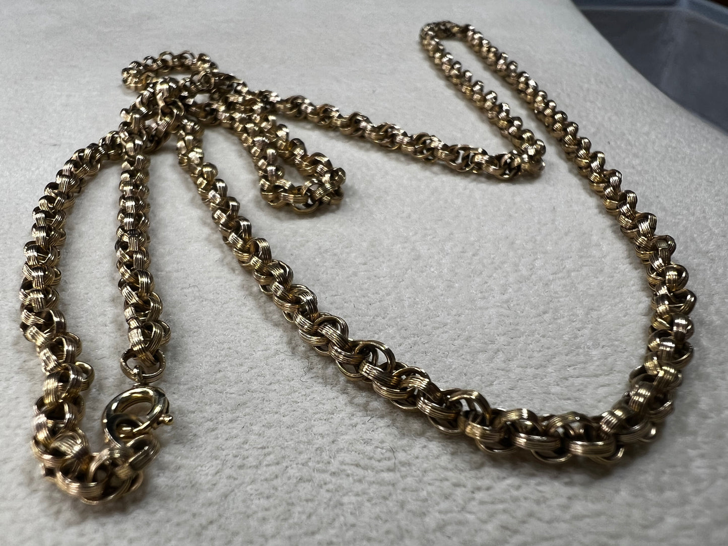 This vintage 26" gold-filled chain features a sturdy double spiral weave, measuring 3.5mm thick for lasting strength. Its elegant gold finish shines on its own while providing a reliable base for any pendant.