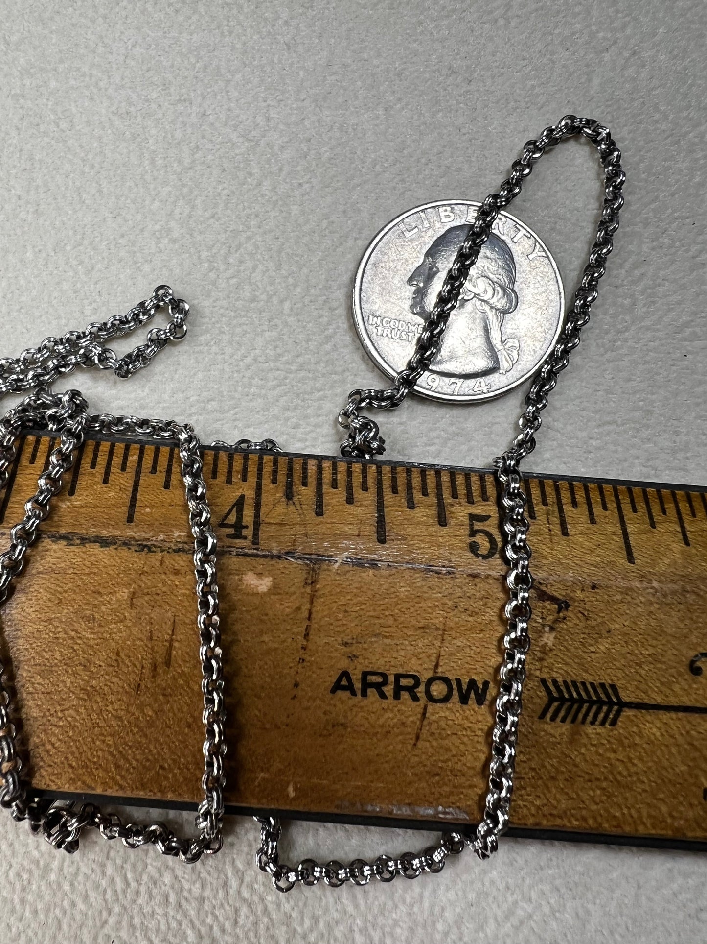This sterling silver chain features a robust double spiral pattern, offering both durability and sophisticated style. Measuring 30 inches, it stands out equally as a solo accessory or when adorned with a pendant.