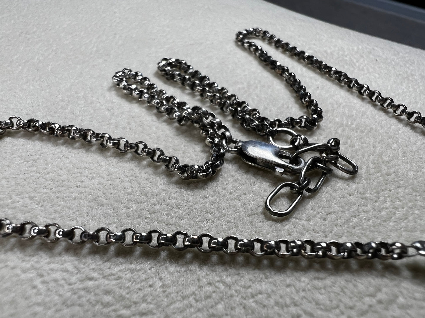 This vintage necklace features a sterling silver chain beautifully complemented by five crystal beaded strands that hang elegantly, creating a distinctive and timeless look.