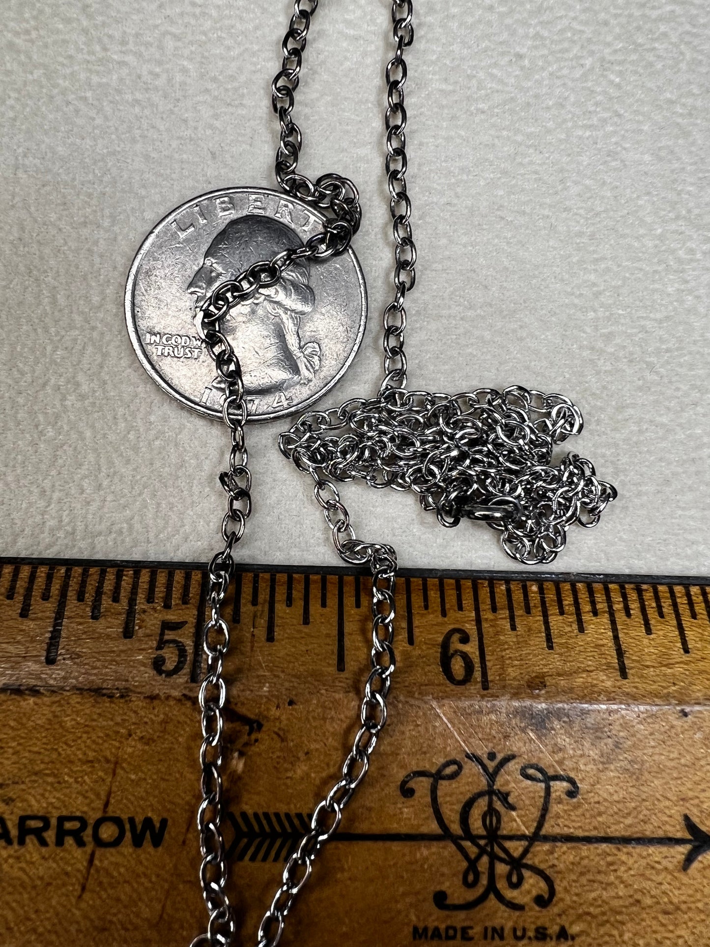 This 24" sterling silver cable chain offers a durable and elegant look that works beautifully on its own or combined with your favorite pendant. Its sturdy design ensures long-lasting wear while adding a subtle shine to your everyday style.