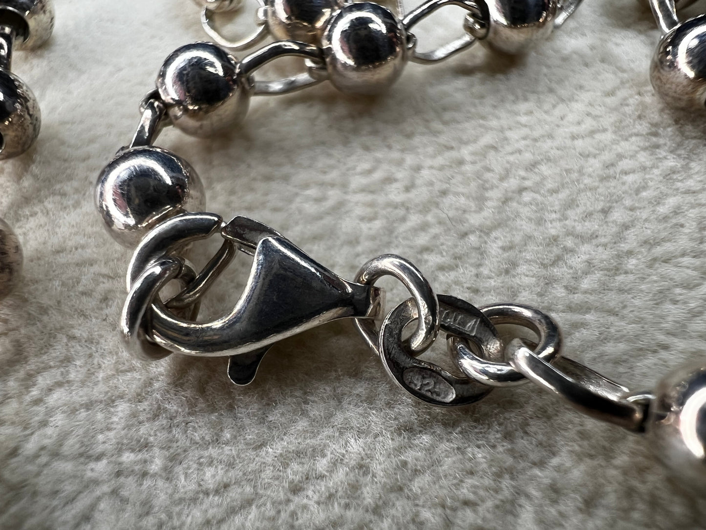 This 16" sterling silver Italian ball and link necklace shines beautifully as the balls reflect light with every movement. Its elegant yet simple design makes it an ideal piece to brighten up any outfit.