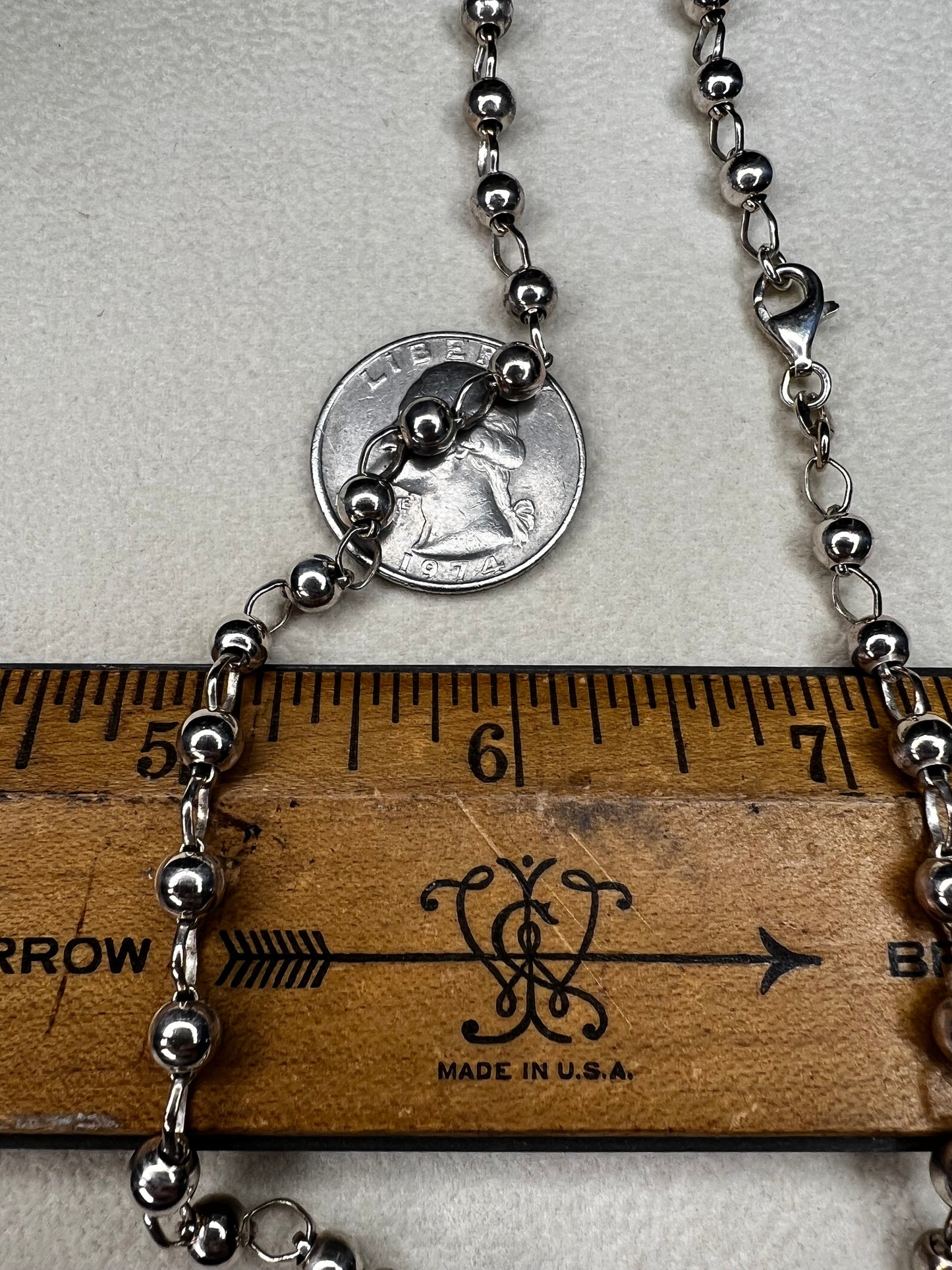 This 16" sterling silver Italian ball and link necklace shines beautifully as the balls reflect light with every movement. Its elegant yet simple design makes it an ideal piece to brighten up any outfit.