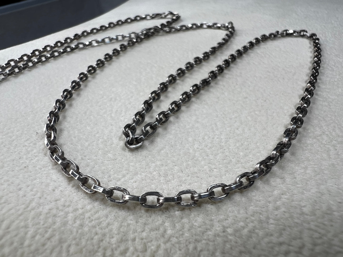 This vintage 26" sterling silver cable chain offers a strong, durable design that stands out beautifully on its own or complements any pendant with ease. Its classic style and reliable construction would make it a versatile addition to your jewelry collection.