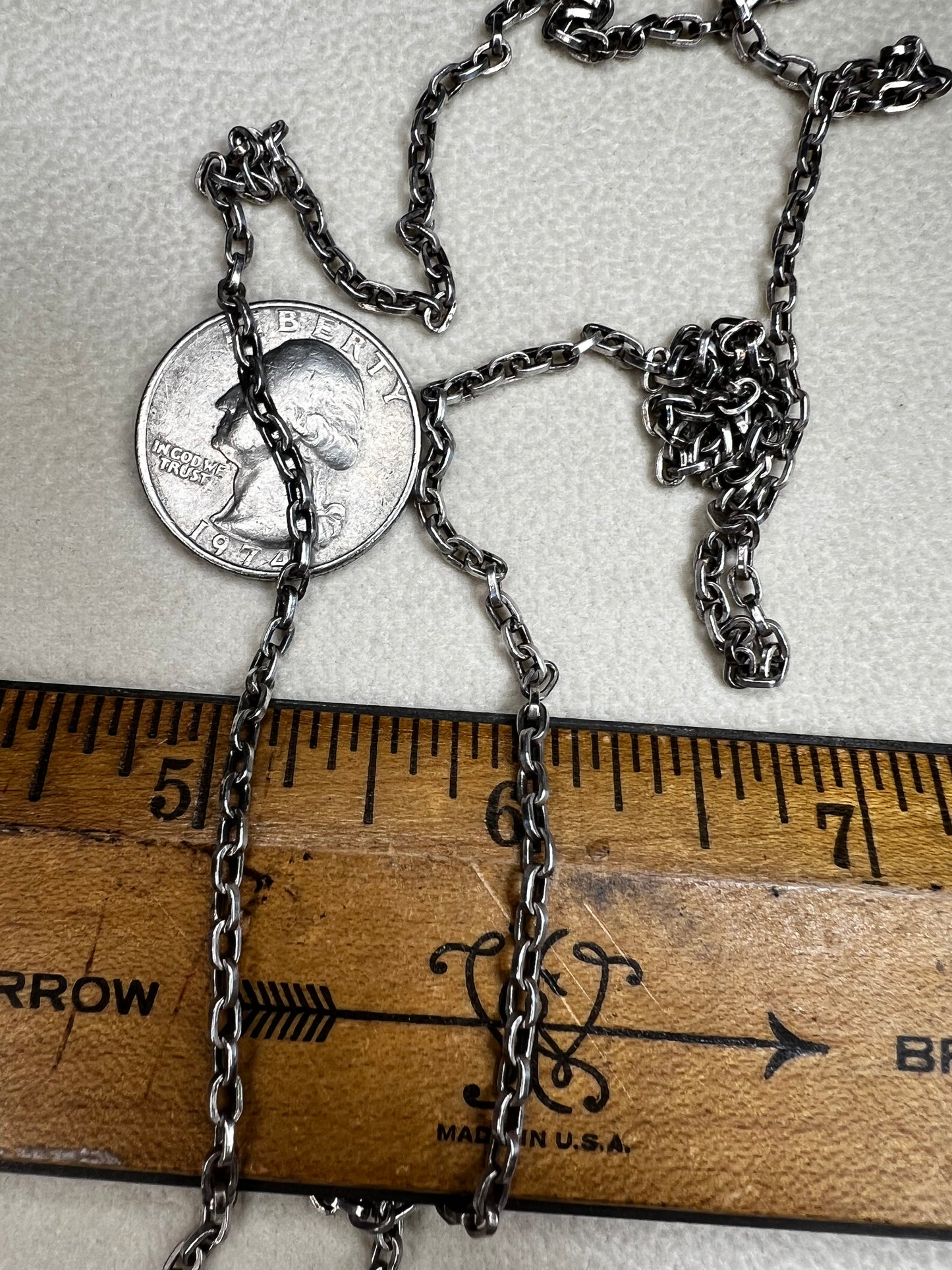 This vintage 26" sterling silver cable chain offers a strong, durable design that stands out beautifully on its own or complements any pendant with ease. Its classic style and reliable construction would make it a versatile addition to your jewelry collection.