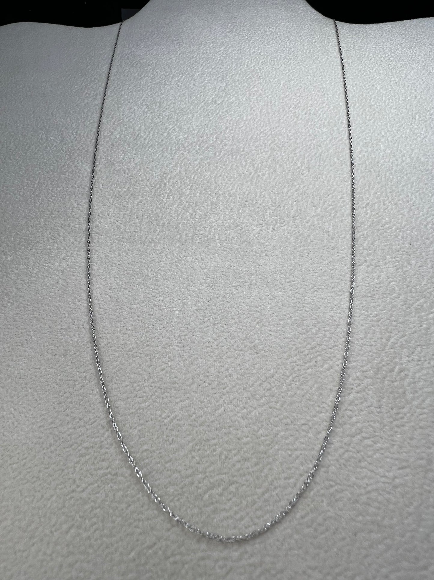 This petite 21" 14 karat white gold chain is a delicate touch of everyday elegance. It's so light that you’ll barely notice it’s there, catching the light to add subtle shine throughout your day. Perfect for layering or wearing alone.