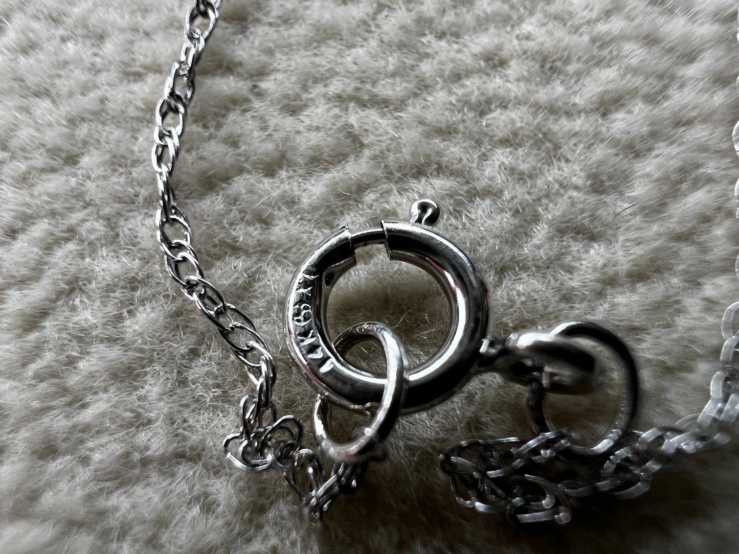 This petite 21" 14 karat white gold chain is a delicate touch of everyday elegance. It's so light that you’ll barely notice it’s there, catching the light to add subtle shine throughout your day. Perfect for layering or wearing alone.
