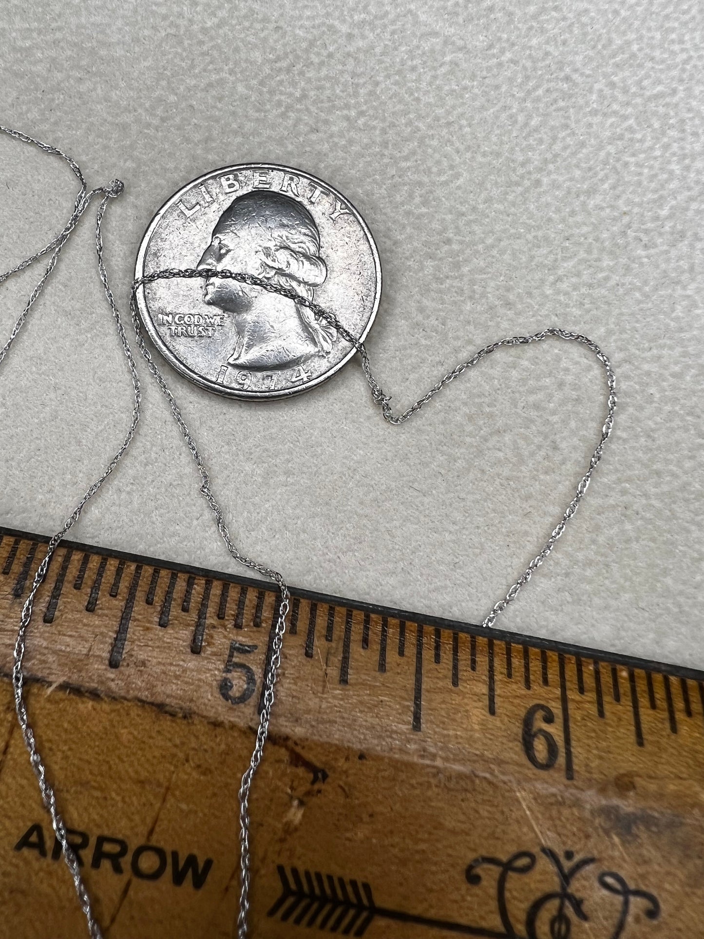 This petite 21" 14 karat white gold chain is a delicate touch of everyday elegance. It's so light that you’ll barely notice it’s there, catching the light to add subtle shine throughout your day. Perfect for layering or wearing alone.