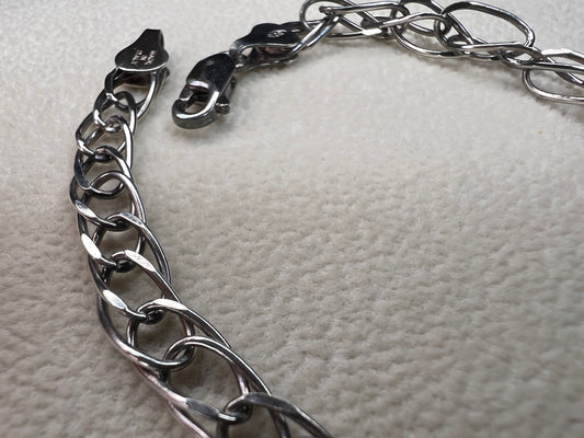 This sterling silver bracelet showcases a timeless design that stands out on its own or can be personalized as a charm bracelet.