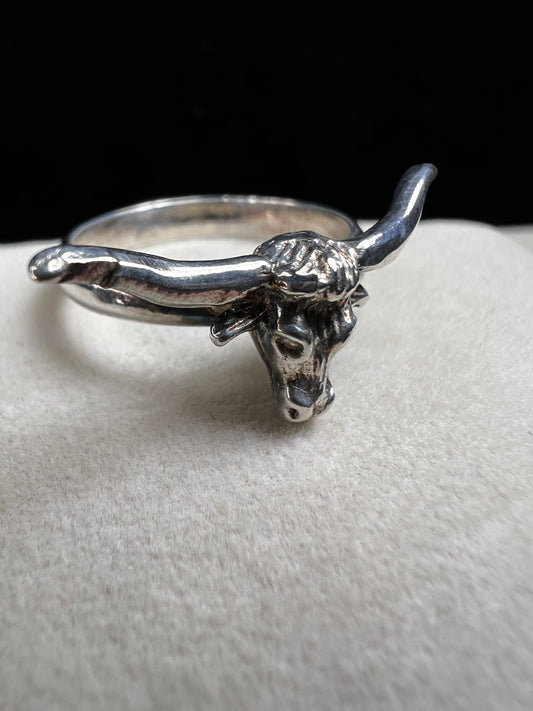 Add a little wild spirit to your style with this sterling silver ring featuring a charming longhorn bull head. Playful yet perfectly detailed, it’s the perfect way to show off your bold side with a touch of fun flair.