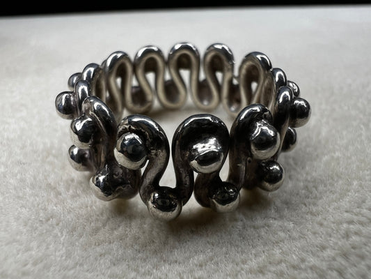 Add a dash of timeless charm to your style with this vintage sterling silver ring. Its unique design captures a playful spirit and will bring a one-of-a-kind flair to any outfit.