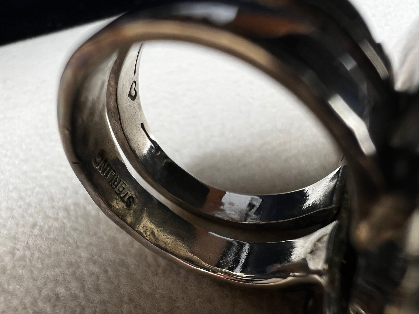 This Loving Anvil ring combines fine sterling silver with a stunning large Herkimer diamond, carefully designed to shine with natural brilliance. The double band adds extra strength, ensuring the ring remains comfortable and secure.