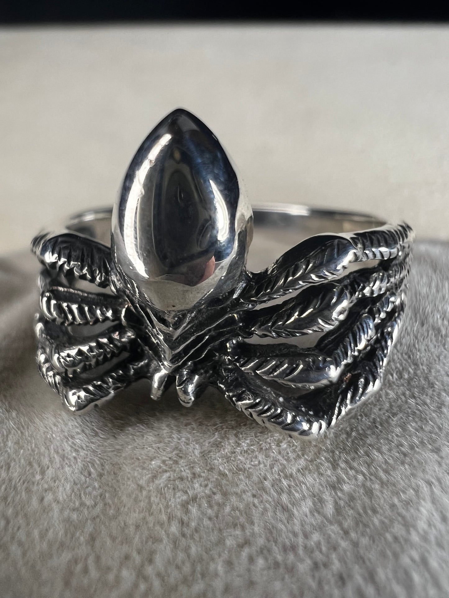 Crafted from sterling silver, this realistically detailed spider ring offers a unique and striking accessory for special occasions. Its intricate design adds a distinctive touch, making it a perfect choice for those who want to express their bold style with confidence.