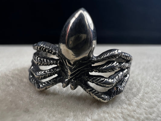 Crafted from sterling silver, this realistically detailed spider ring offers a unique and striking accessory for special occasions. Its intricate design adds a distinctive touch, making it a perfect choice for those who want to express their bold style with confidence.