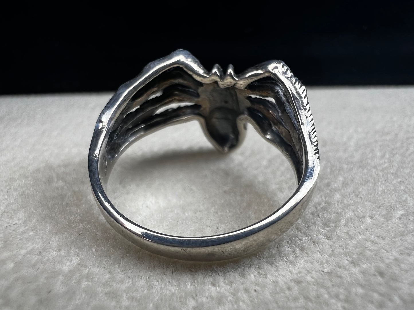 Crafted from sterling silver, this realistically detailed spider ring offers a unique and striking accessory for special occasions. Its intricate design adds a distinctive touch, making it a perfect choice for those who want to express their bold style with confidence.