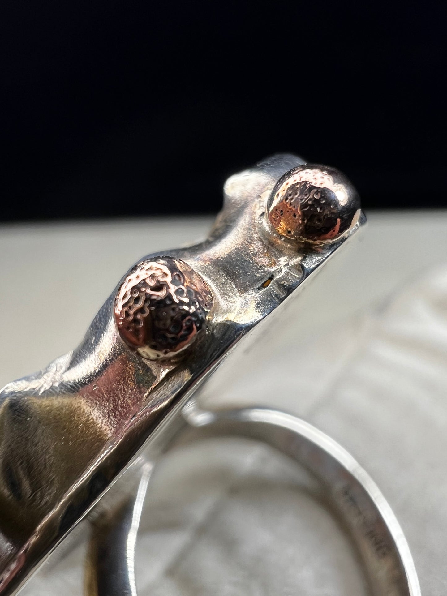 This exquisite ring by Loving Anvil showcases a natural druzy agate slice wrapped in fine sterling silver. Delicately embellished with two small gold accents, the design highlights the stone’s unique open space, creating a one-of-a-kind piece.