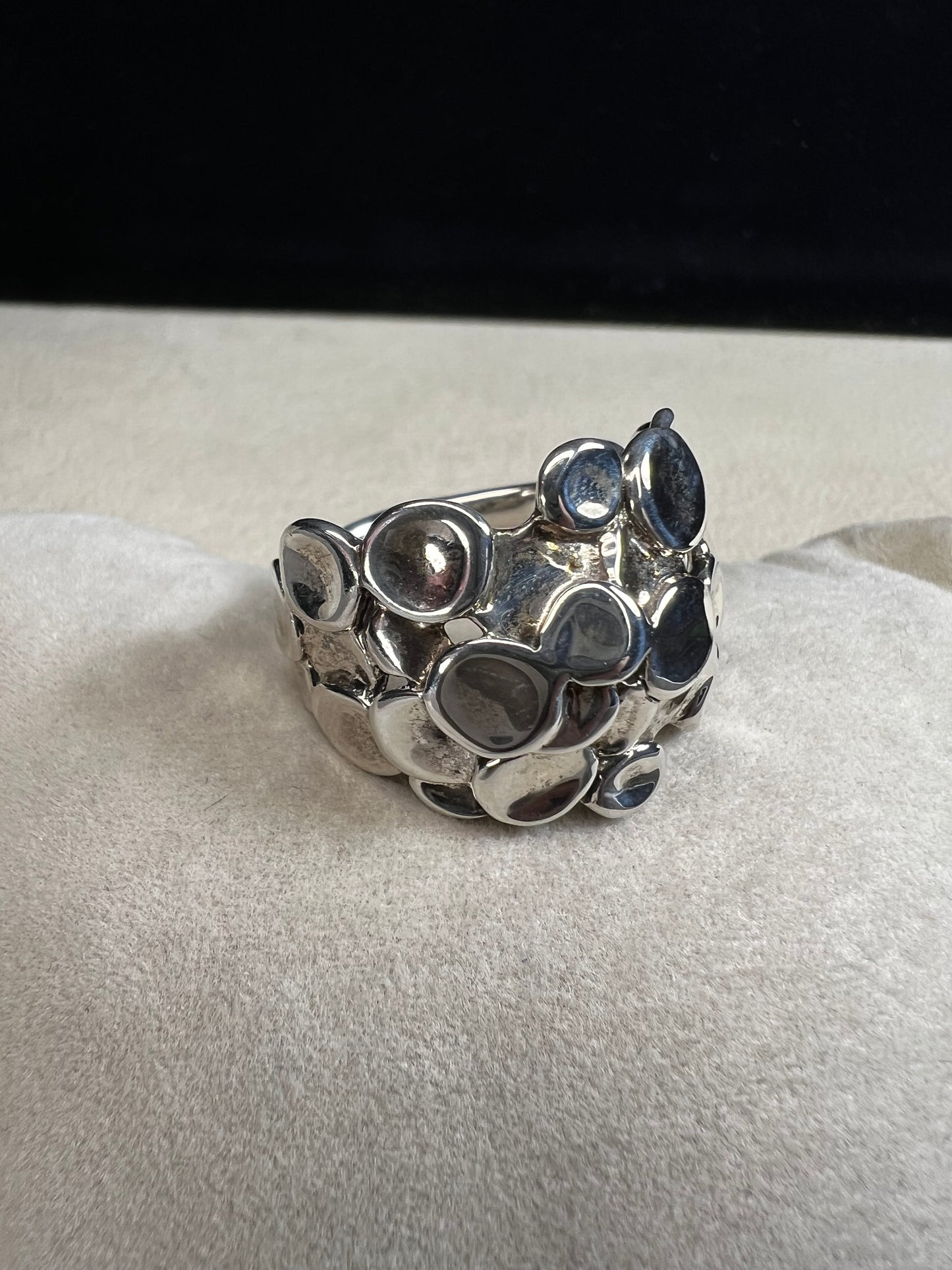 This sterling silver ring by Israeli designer Hagit Gorali is expertly crafted to reflect light beautifully, enhancing your style with a radiant and elegant glow.