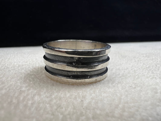 Experience timeless elegance with this vintage Mexican sterling silver ring. Crafted with a wide band and authentic silversmith stamping, it guarantees genuine quality and character. Perfect for anyone seeking a unique piece that carries both history and style.