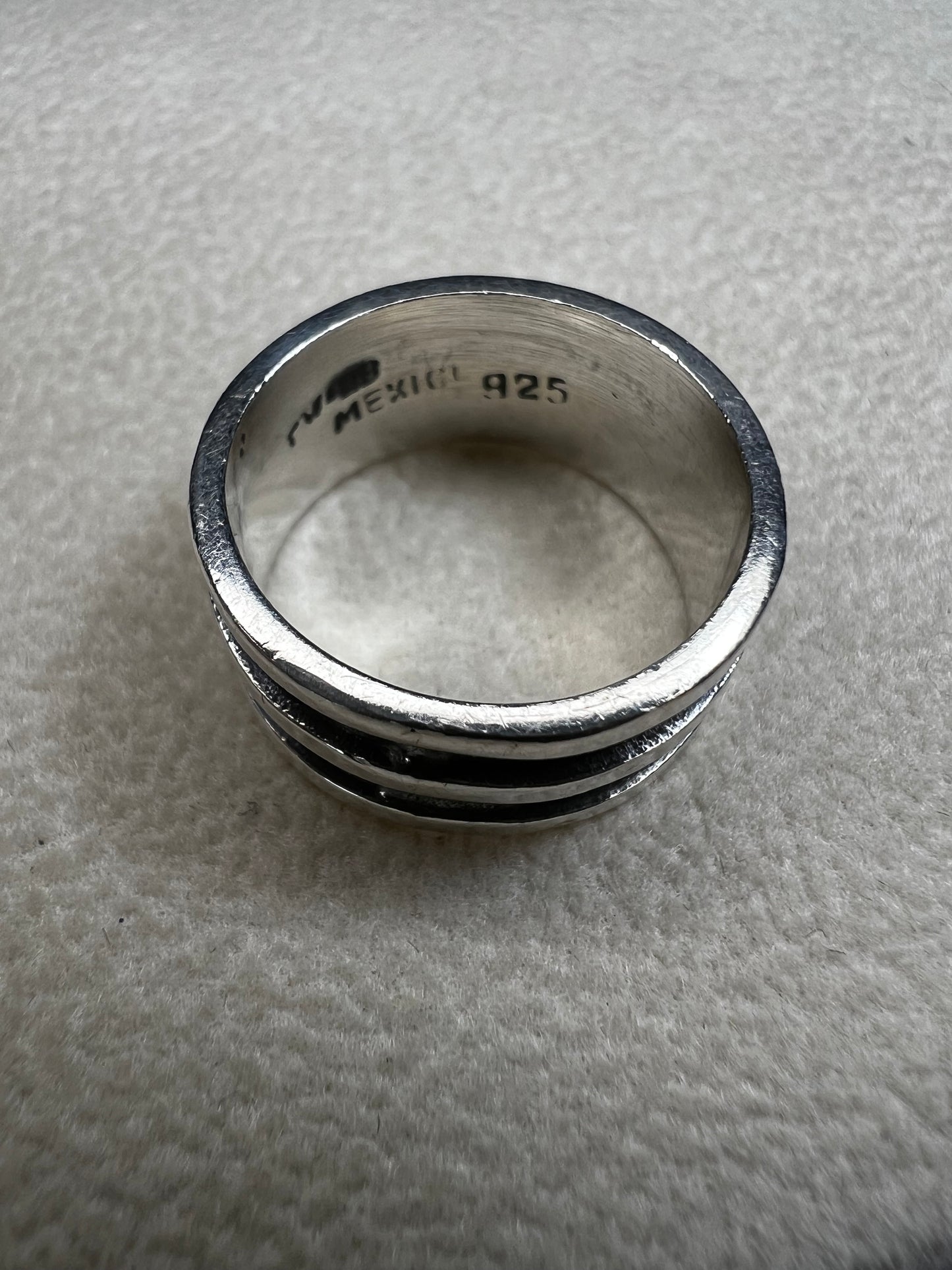 Experience timeless elegance with this vintage Mexican sterling silver ring. Crafted with a wide band and authentic silversmith stamping, it guarantees genuine quality and character. Perfect for anyone seeking a unique piece that carries both history and style.