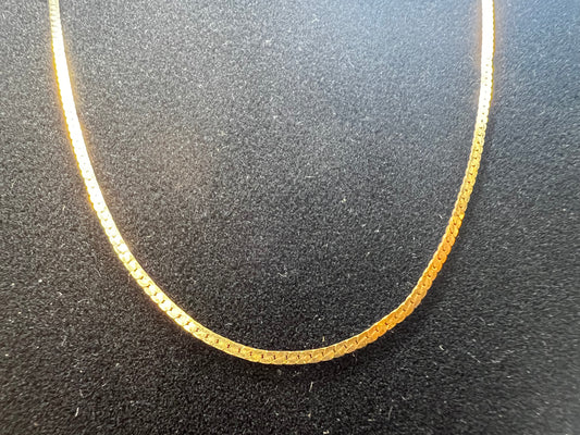 This 10 karat gold necklace is a generous 24 inches in length. It can be worn alone or paired with one of our gold pendants.