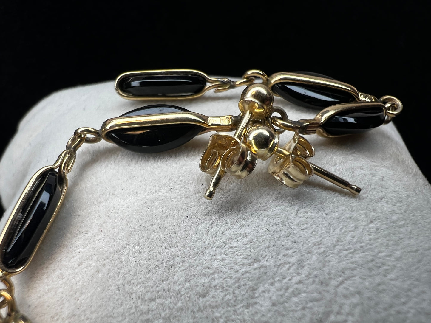 Crafted from 14 karat gold, the 2" length of these earrings will add some movement to your outfit.