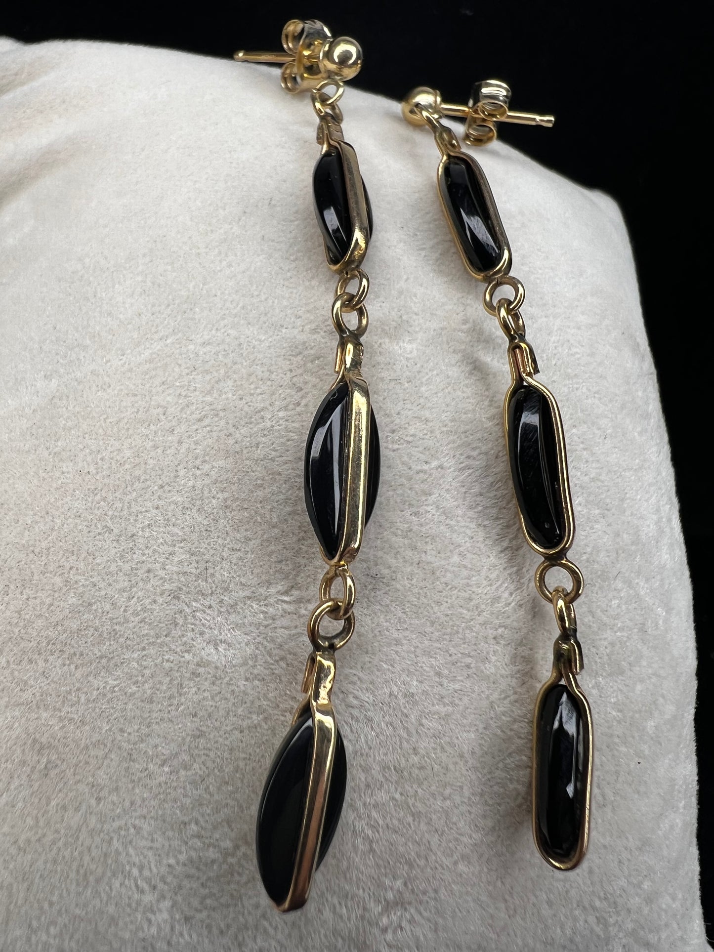 Crafted from 14 karat gold, the 2" length of these earrings will add some movement to your outfit.