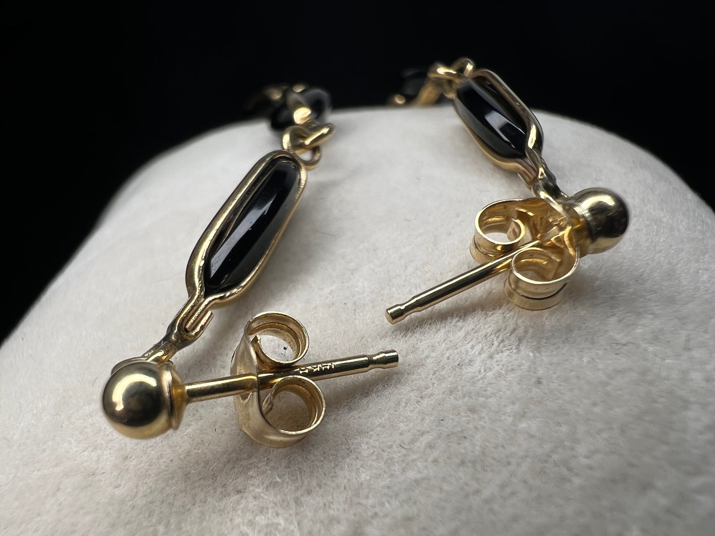 Crafted from 14 karat gold, the 2" length of these earrings will add some movement to your outfit.