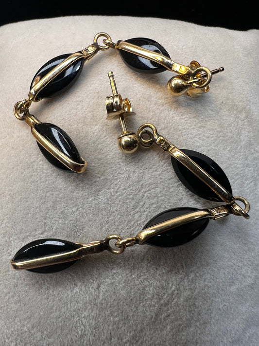 Crafted from 14 karat gold, the 2" length of these earrings will add some movement to your outfit.