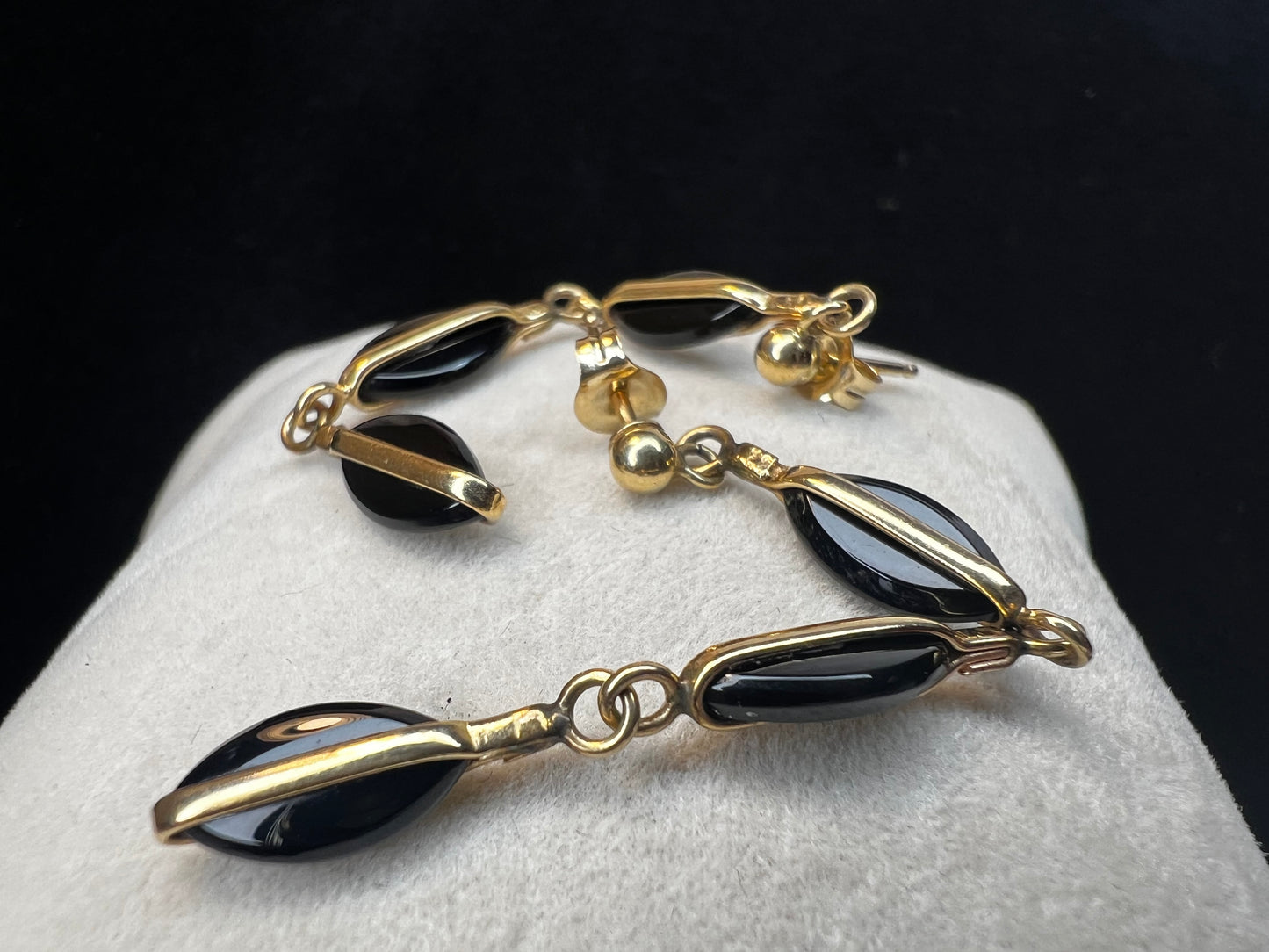 Crafted from 14 karat gold, the 2" length of these earrings will add some movement to your outfit.