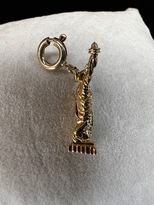 This 14 karat gold charm is fitted with a spring clasp so it can be easily removed and added to any charm bracelet.