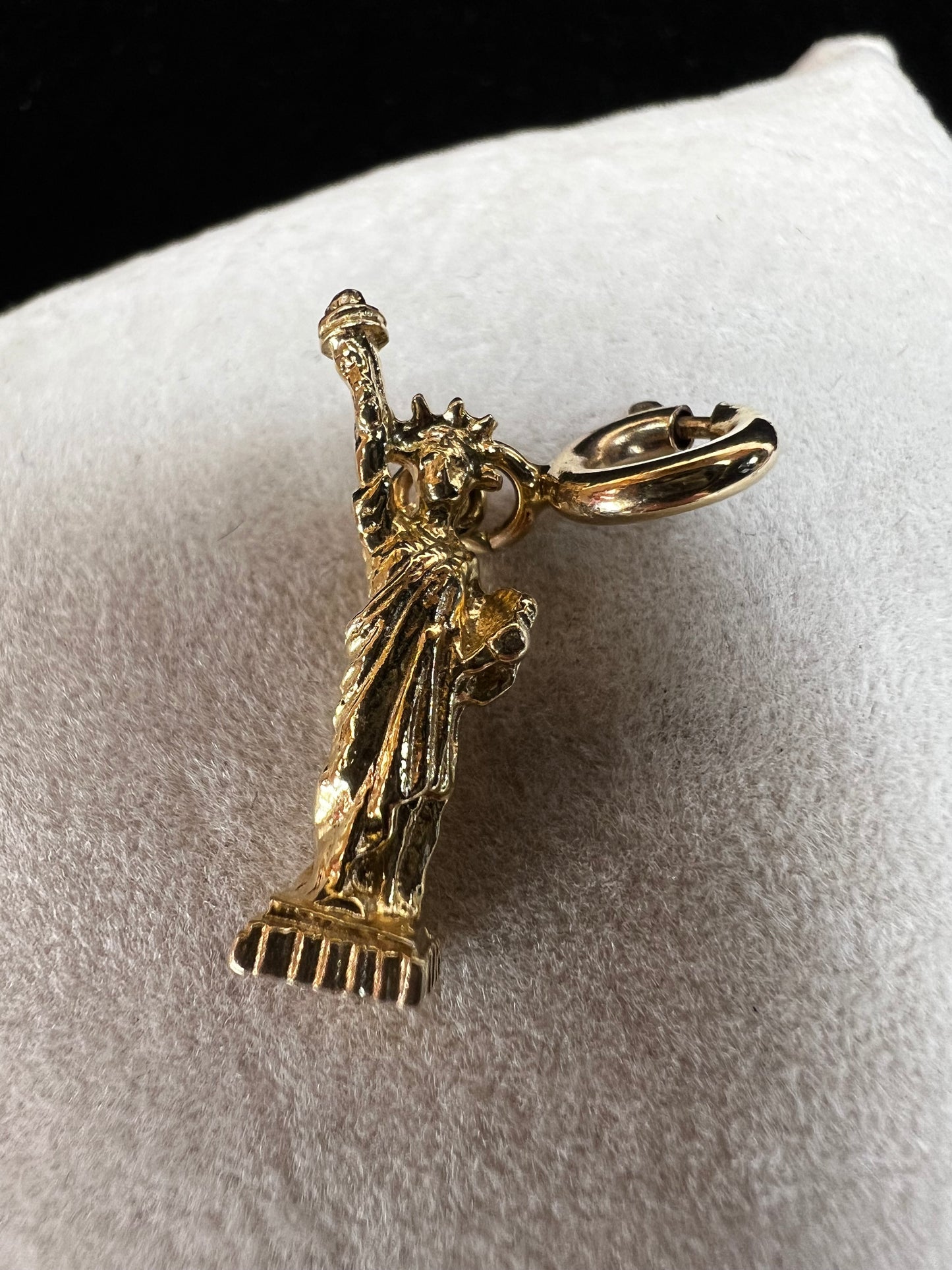 This 14 karat gold charm is fitted with a spring clasp so it can be easily removed and added to any charm bracelet.