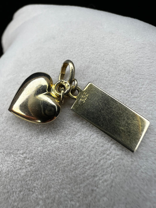 This vintage piece is made from 8 karat gold and can be used as a charm or pendant.