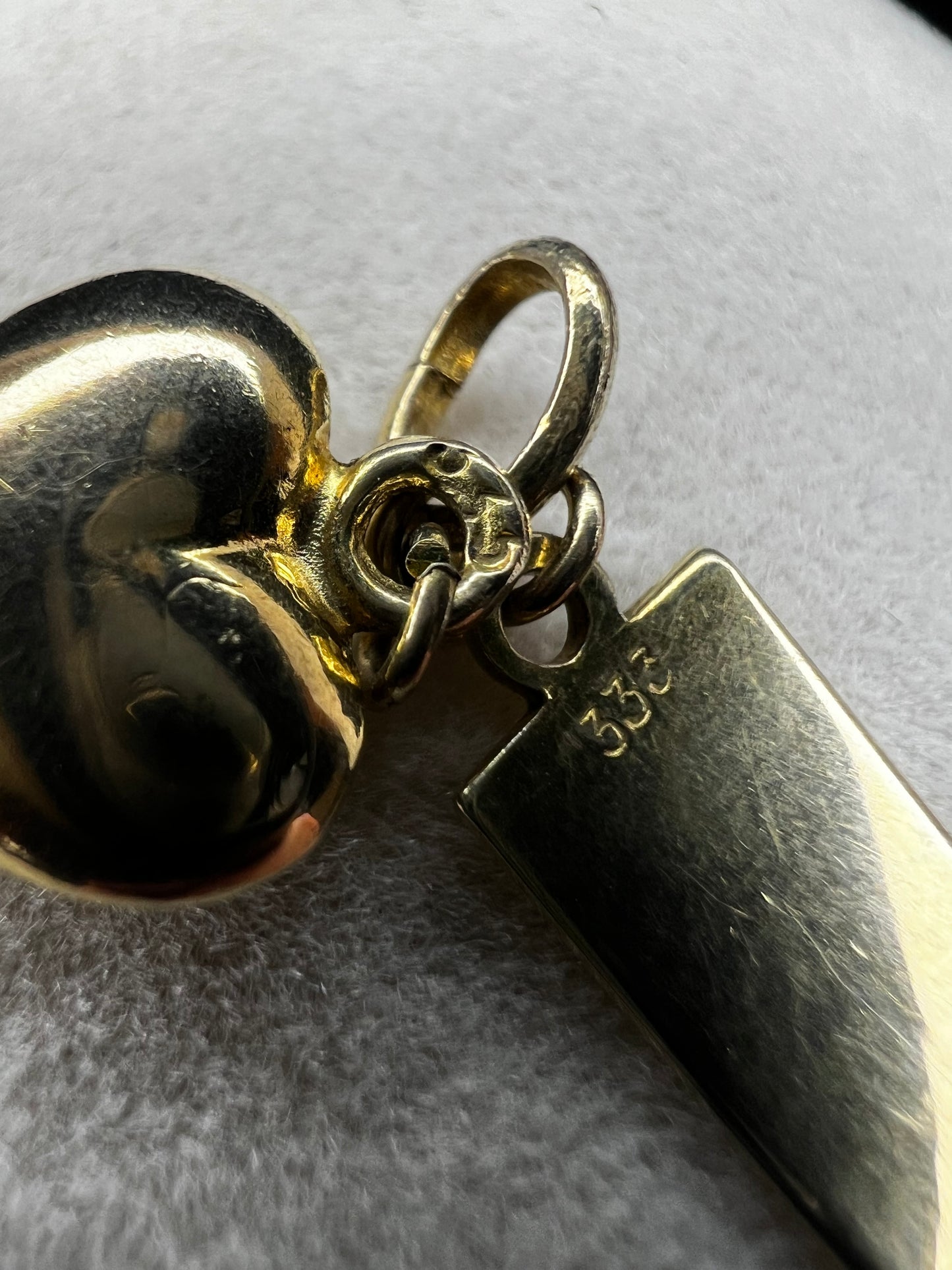 This vintage piece is made from 8 karat gold and can be used as a charm or pendant.