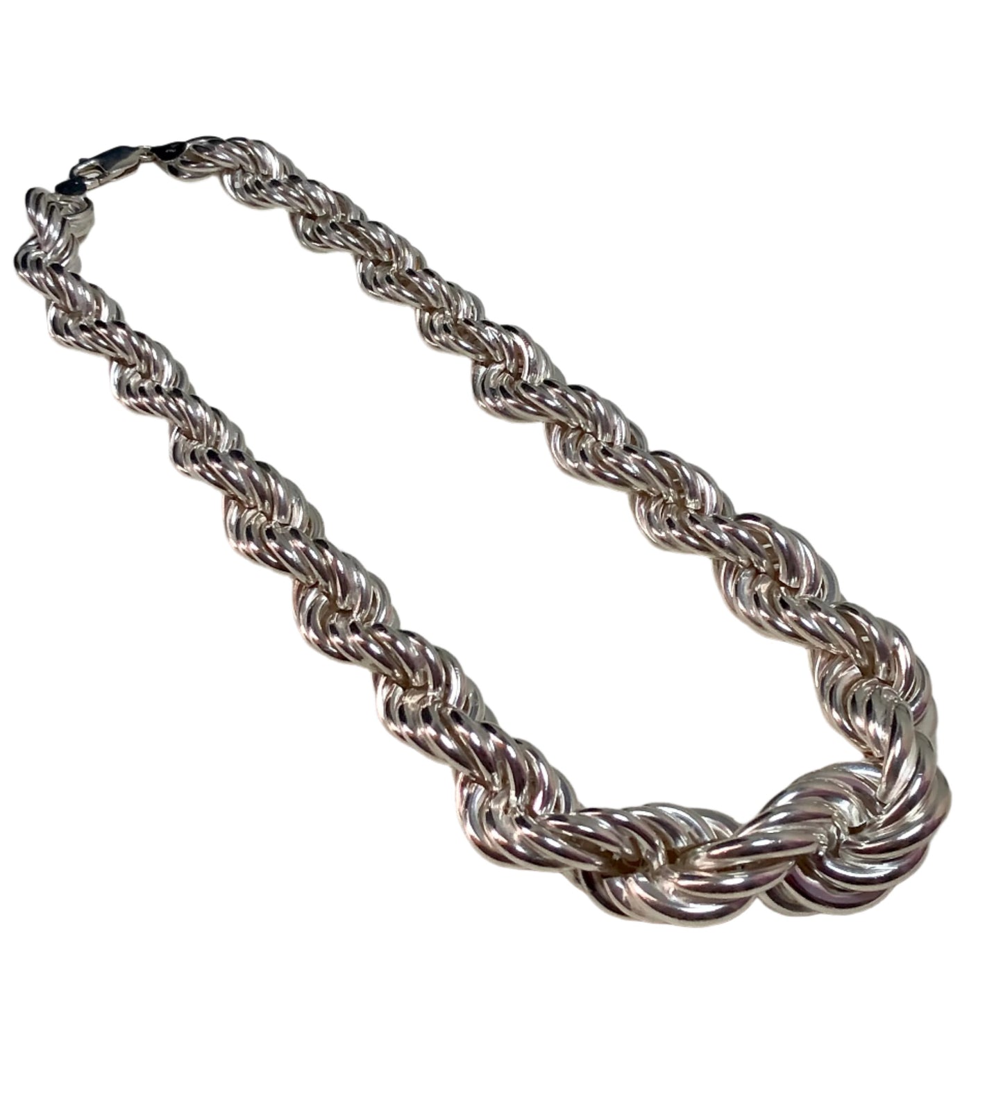 This sterling silver beauty boasts a large rope-style chain. The twisting links are largest front and center, and gradually become smaller until they join at the clasp.