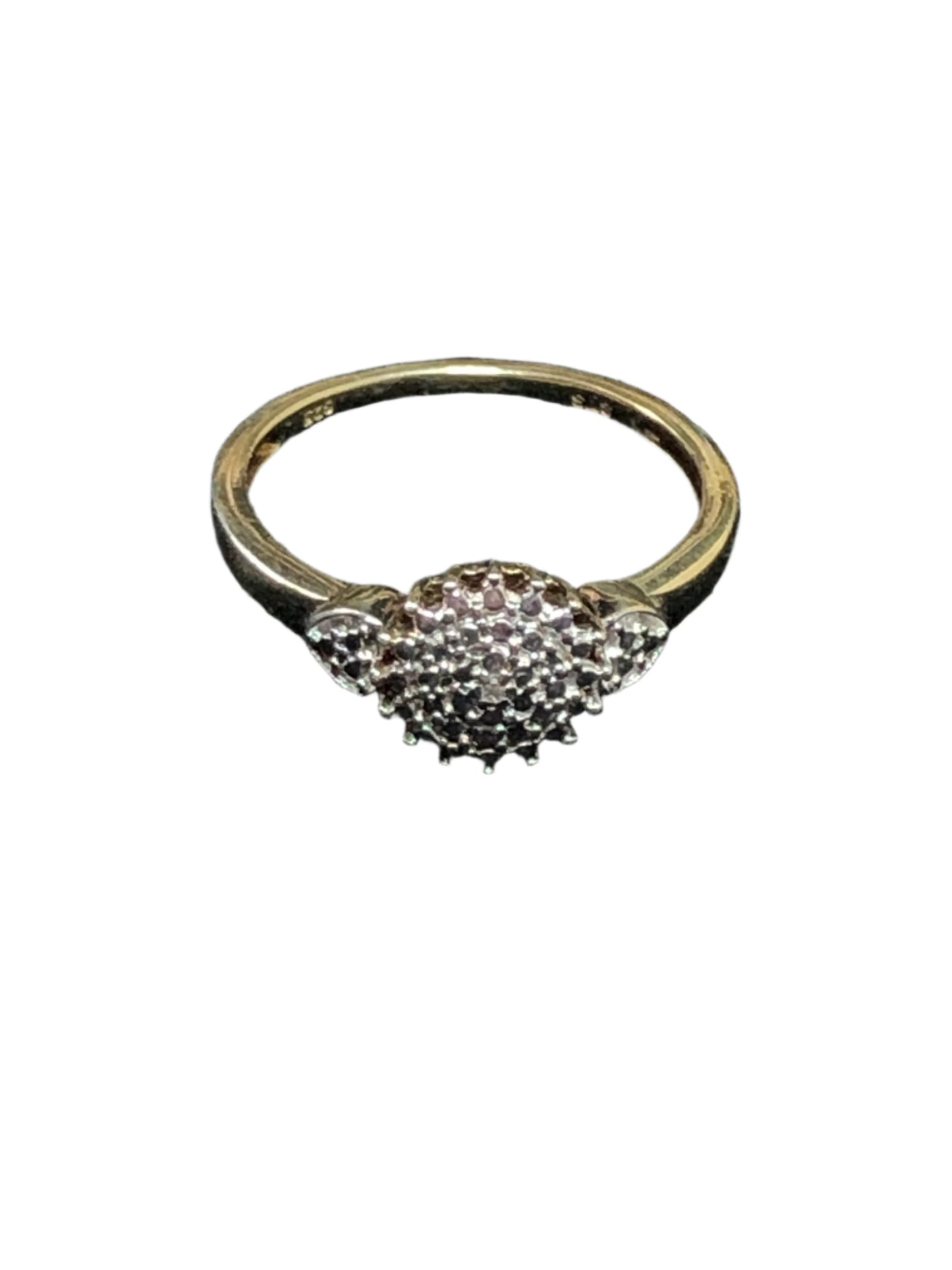 This sterling silver ring is elegantly set with a luxurious gold overlay. It features a dazzling sunburst design.