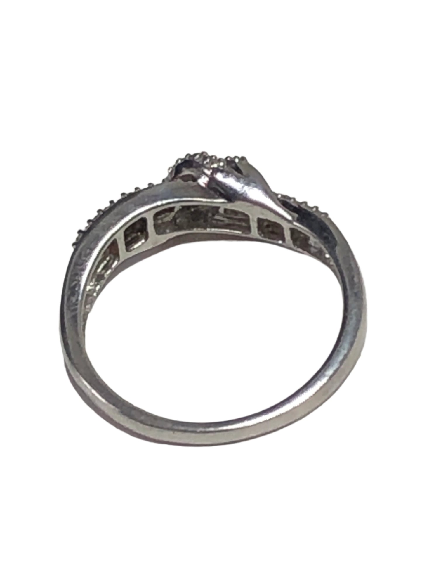 This stunning sterling silver ring boasts dazzling diamonds in an elegant setting. Some of the diamonds are marquee-cut, and others are square. The ring's delicate yet bold design makes it a unique way to show off your style.