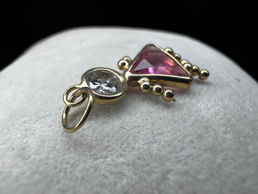 Crafted with 14 karat gold and set with crystals. this is a beautiful piece for anyone with a daughter or other special girl in their life.