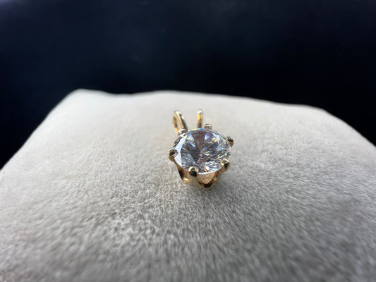 This is a lovely 14K gold pendant with a cubic zirconia ready to be paired with one of our gold chains.