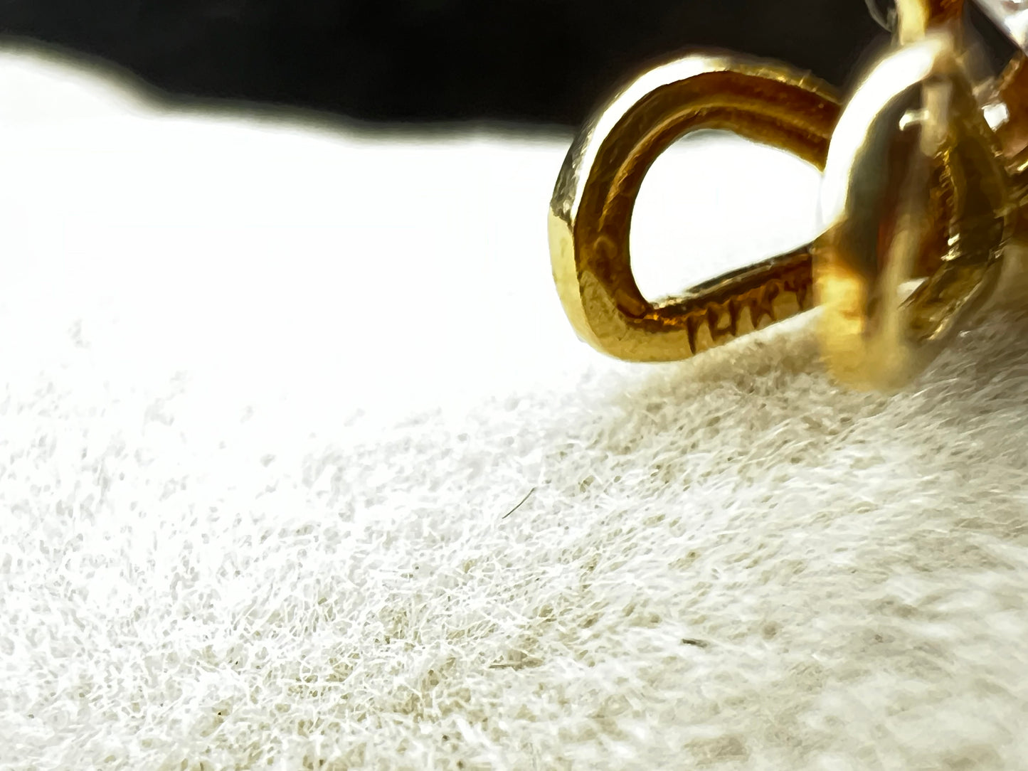 This is a lovely 14K gold pendant with a cubic zirconia ready to be paired with one of our gold chains.