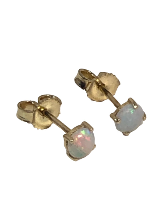 These 14 karat gold stud earrings are adorned with shimmering opals. They are suited for casual wear or a dressier outfit.