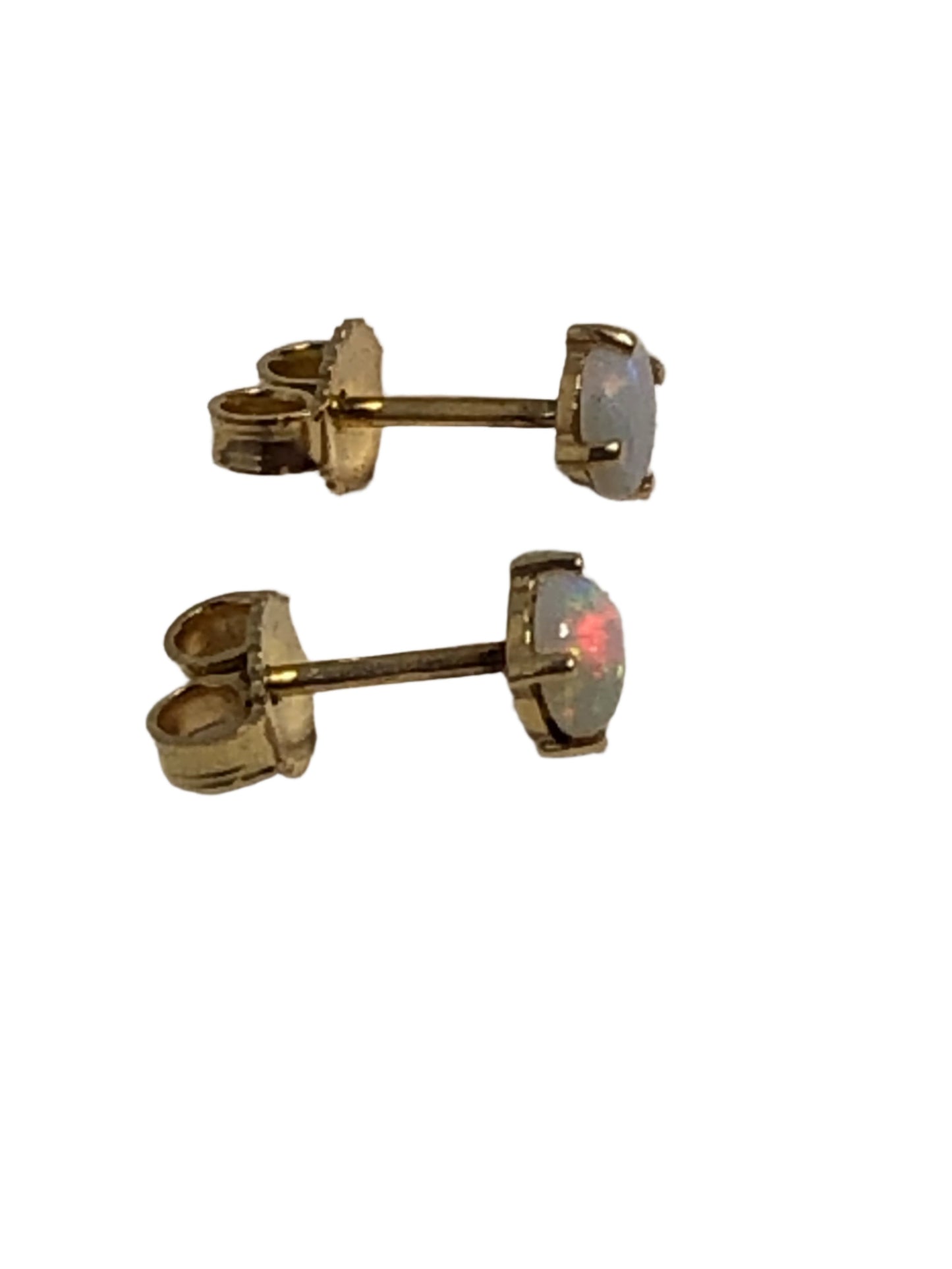 These 14 karat gold stud earrings are adorned with shimmering opals. They are suited for casual wear or a dressier outfit.