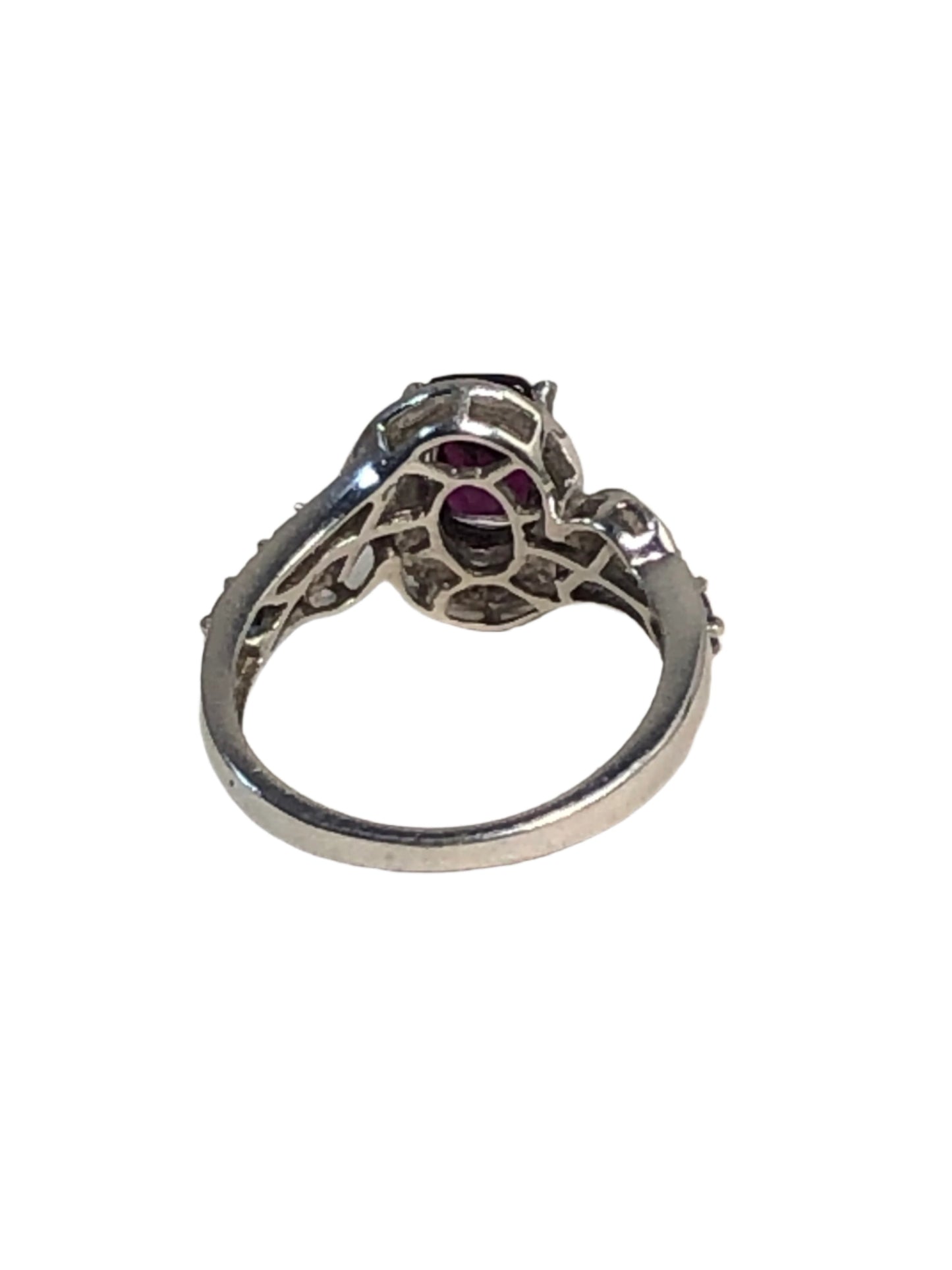 This sterling silver ring boasts a purple tourmaline centerpiece with a stylishly faceted cut. Each side of the band features smaller pale purple tourmalines.