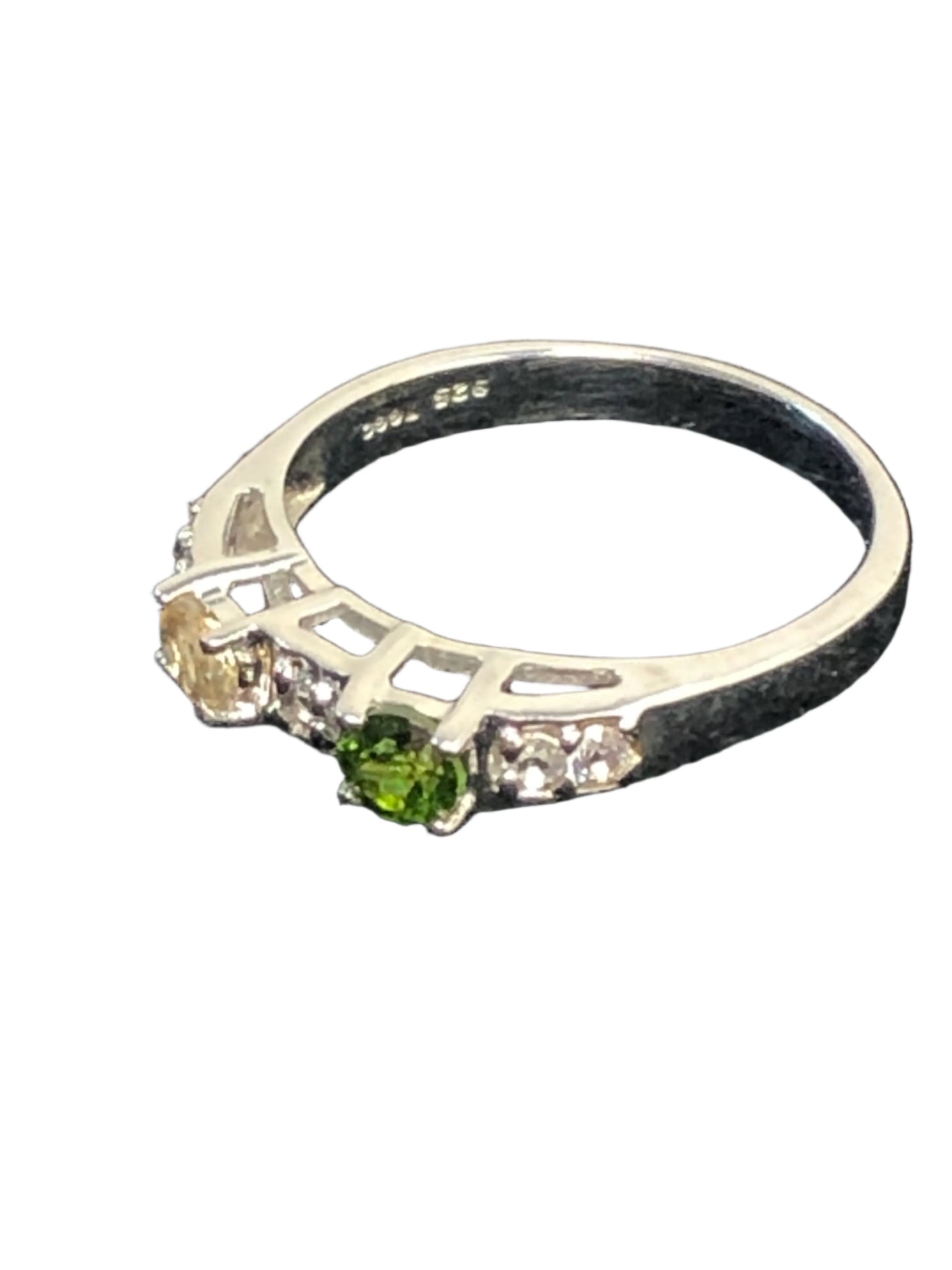 This is a sterling silver ring featuring natural gemstones (green, yellow and white/clear). It's a nice look for everyday wear or for special occasions.
