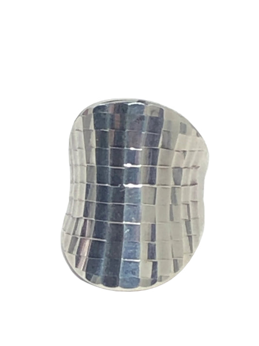 This sterling silver ring is daring and individualistic. It features a crisscross pattern, allowing each small square to shine as light hits it.