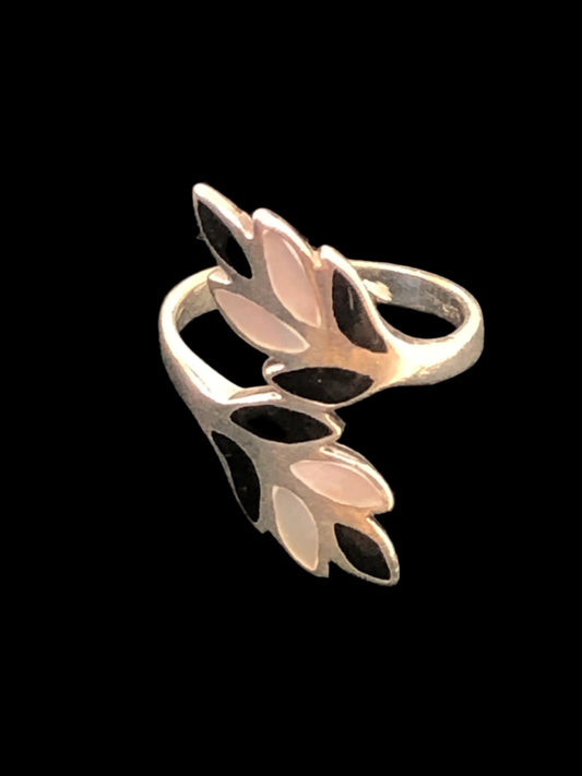 This sterling silver ring makes a statement with its eye-grabbing design and use of black enamel and pearlescent accents.