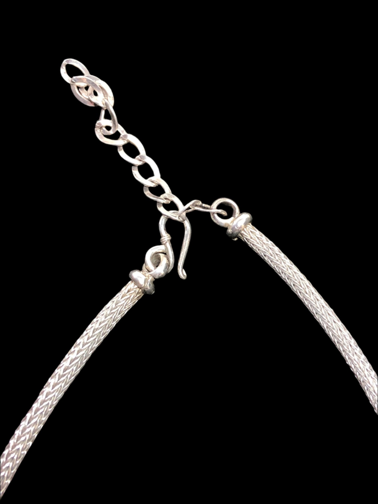 Get ready to make a statement with this sterling silver necklace. Adorned with a cluster of beads (also sterling silver) front and center, this piece will complement a variety of looks.