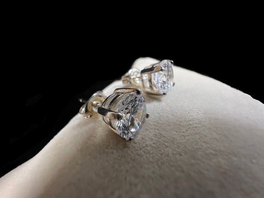 These sterling silver stud earrings will add a touch of subtle elegance to any outfit. They feature cubic zirconia stones, which sparkle like diamonds without the higher cost.