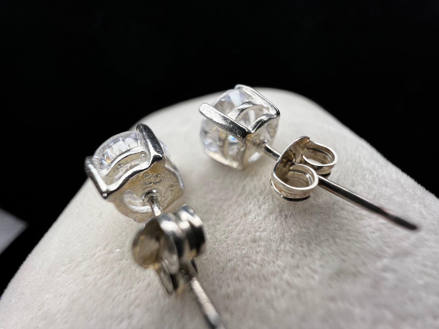 These sterling silver stud earrings will add a touch of subtle elegance to any outfit. They feature cubic zirconia stones, which sparkle like diamonds without the higher cost.
